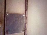 a close up of a metal plate on a door