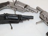 two revolvers that are sitting on a table