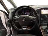 the interior of a car with a steering wheel, dashboard, and dashboard controls
