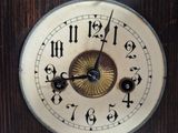 a close up of a clock with roman numerals on it
