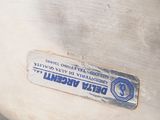 a close up of a metal object with a label on it