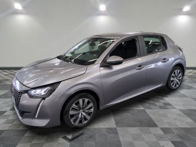 the silver car is parked on a checkered floor in a room