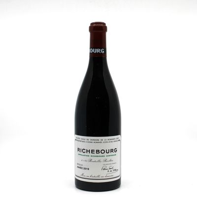 a bottle of wine that is sitting on a table