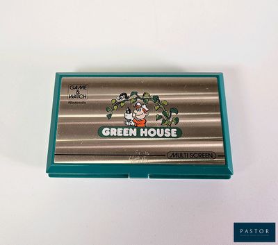 un porte-cartes de visite en forme de serre posé sur une table