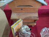 a table with a birdhouse and other items on it
