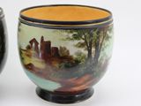 two vases that have been painted with a landscape on them