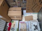a pile of boxes sitting on the floor next to each other