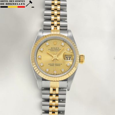 an image of a lady ' s rolex watch with yellow dial and diamond markers
