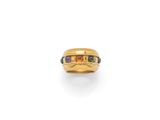 an 18k gold ring with multi colored stones