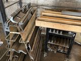several pieces of wood are stacked on a cart in a warehouse