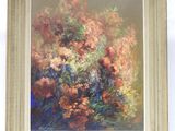une peinture à l'huile représentant un bouquet de fleurs, dans un cadre doré
