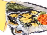a close up of a folded up purse with flowers on it