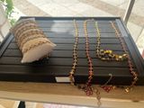 a display case with a bunch of necklaces on it