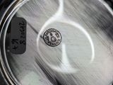 an image of a close up of a metal pan with a label on it