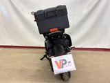 a black motorcycle with a box on the back of it