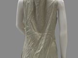 an image of a mannequin wearing a beige top and black pants