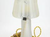 a lamp that is sitting on a table next to a cord