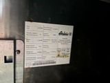 a picture of a ticket and a cell phone on a metal surface