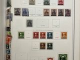 a book with a picture of a large collection of stamps on it
