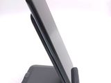a cell phone that is sitting on top of a stand