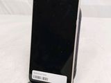 a cell phone that is on a stand on a table