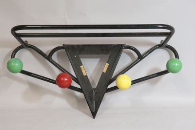 a picture of a black metal wall hanging with colorful balls