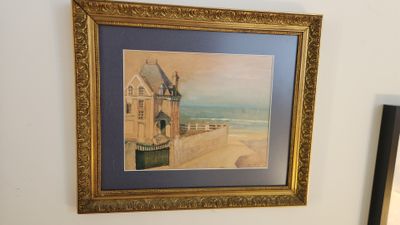 a picture of a painting hanging on the wall above a toilet