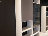 an image of a room that has some shelves and cabinets in it
