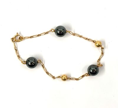 Bracelet en or 750‰ à maille fantaisies et à décor en altern…