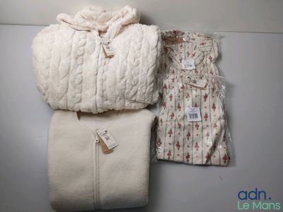 two blankets and a blanket bag sitting on top of a table