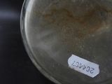 a glass jar with a label on it sitting on a table