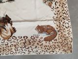an image of a scarf with a picture of a squirrel and a squirrel on it