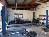 a pile of tires in the garage of a building