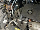 the engine of a car with its hood open and the hood down