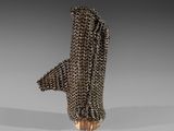 a close up of a metal object with chains on it
