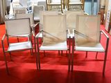 four chairs in a room with a red carpet