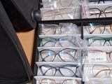 a drawer full of glasses that are sitting on a desk