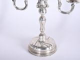 a silver candelier that is sitting on a table