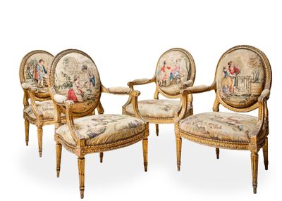 three chairs with a tapestry on the back of them and a chair with a foot rest