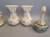three vases sitting next to each other on a table