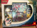 a box of pokemon cards sitting on a table
