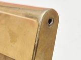brass plated picture frame with a small hole in the middle