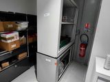 an image of a kitchen with a refrigerator and a stove