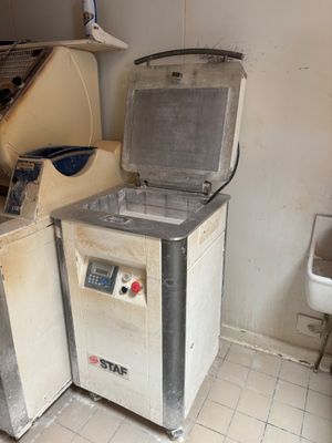 two machines that are sitting in a room
