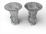 two glass vases that are sitting on a white surface