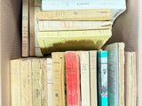 a box full of books sitting on top of a table