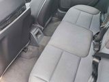 a picture of the inside of a car with the seats down