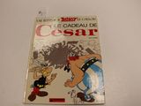 une image représentant un livre posé sur une table, sur lequel figure l'illustration d'un personnage de dessin animé