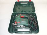 an image of a green tool box with a corded hammer in it