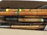 a box full of different types of baseball bats